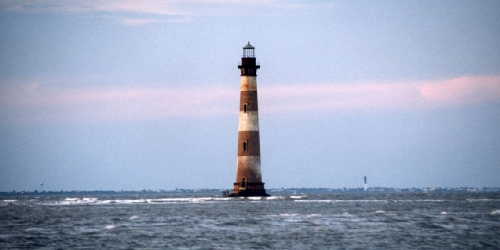 Morris Island Lighthouse with new Charleston lighthouse in background on Sullivan's Island